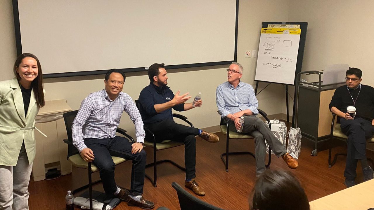 Group of people smiling in a business meeting