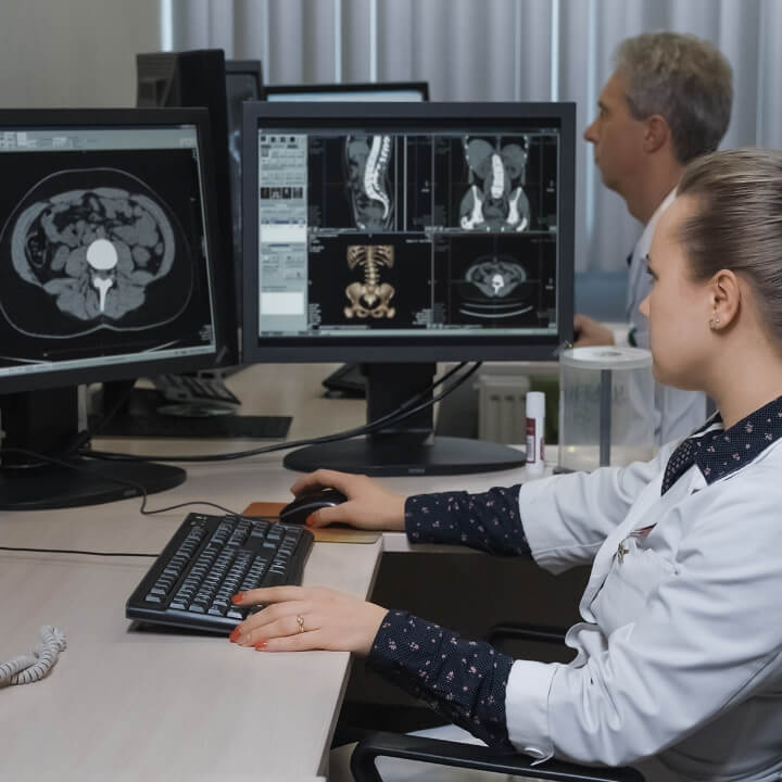 Two doctors looking at imaging