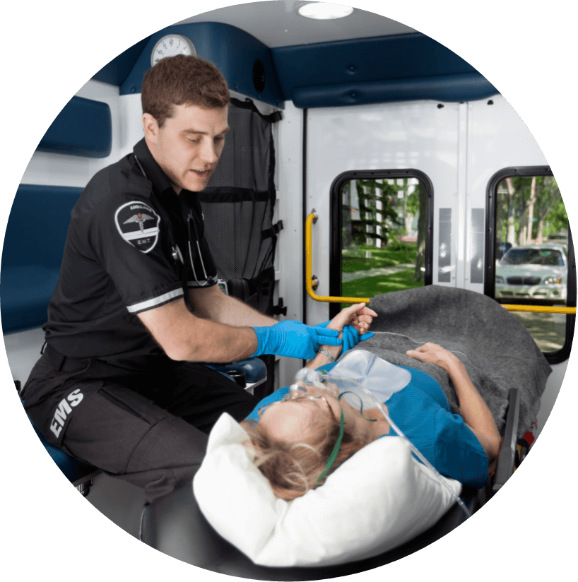 EMT assessing a woman in an ambulance