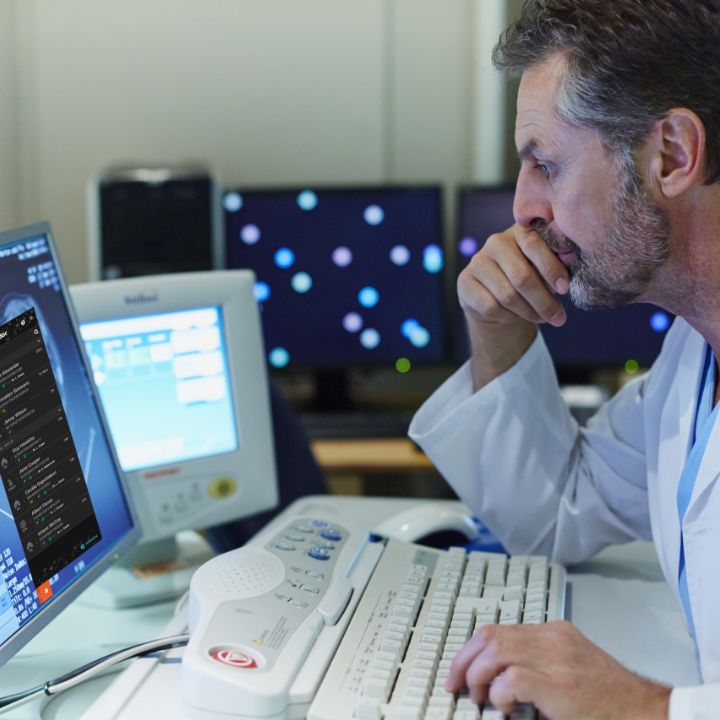 A doctor scrolling through some emails