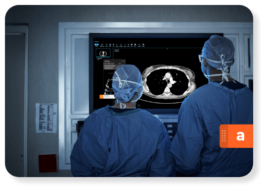 Doctors looking at AI imaging