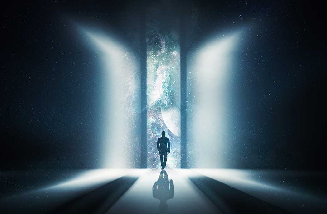 A man walking through a door that's opening up to the universe