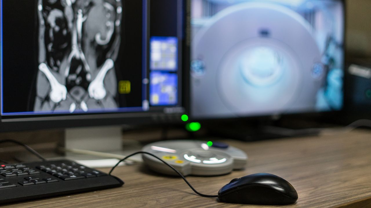 AI imaging on desktop computer with a black mouse in front on the desk