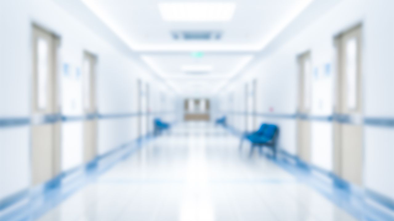 Blurry image of an empty hospital hallway