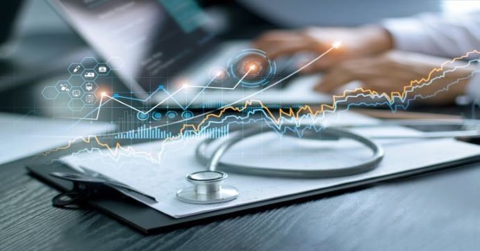 Physician typing notes on computer
