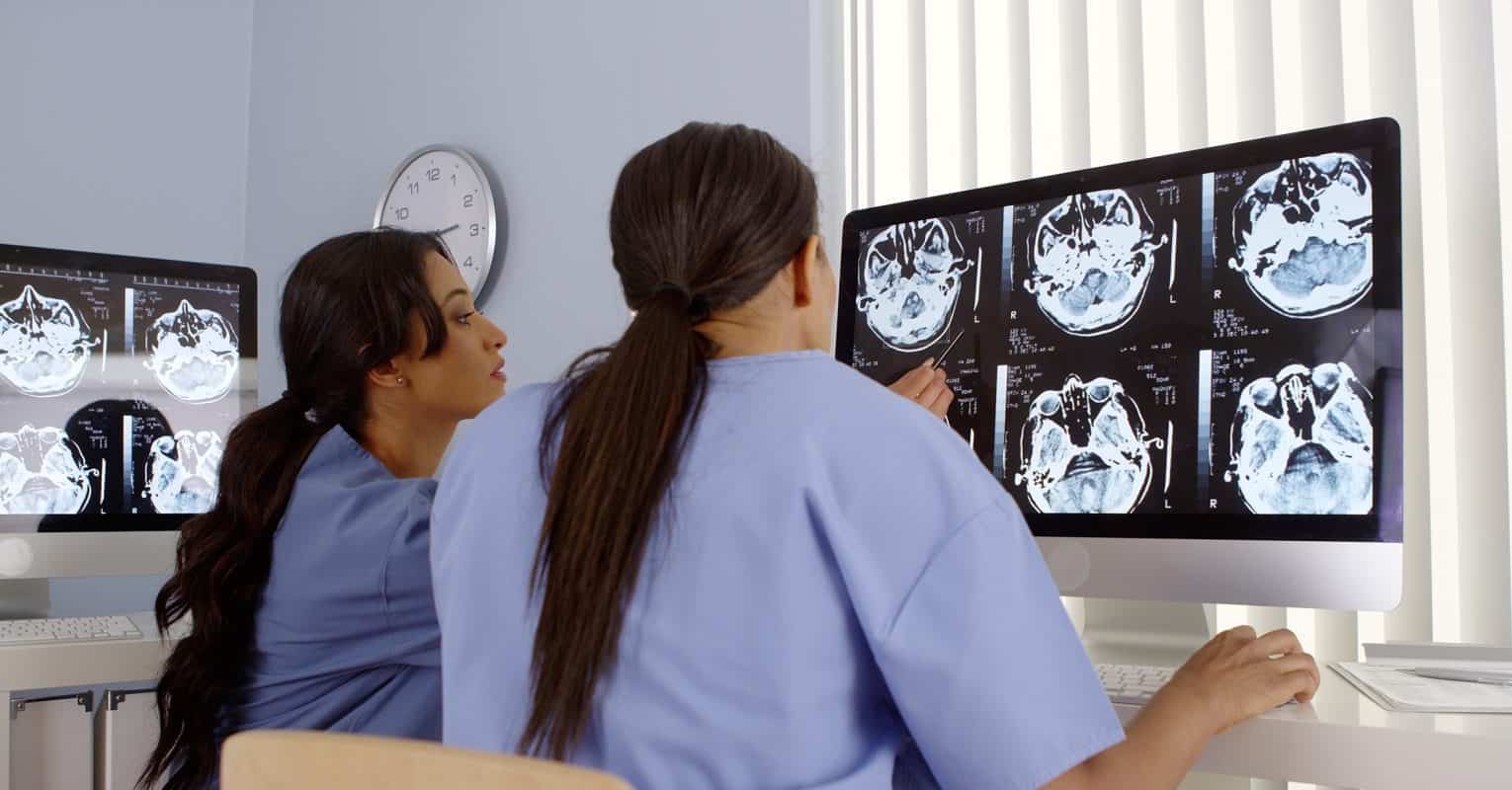 Radiologists analyzing AI imaging